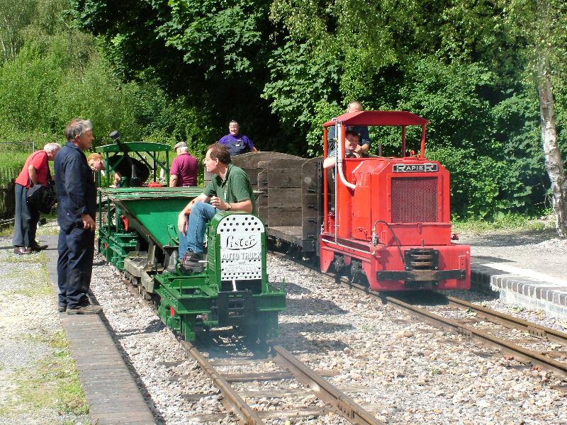 lister-rapier12.jpg - Saturday morning dawned and soon the railway was a hive of activity. Here our Ransomes & Rapier diesel, RR80/1936, arrives at Brockham while a bevvy of Listers awaits departure for Amberley.