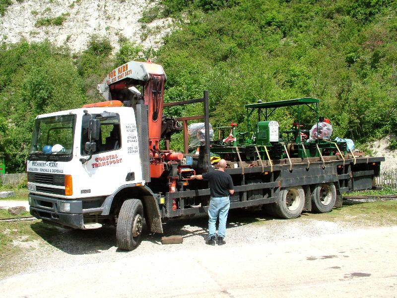 listerunload02.jpg - The first sign that anything unusual was about to happen was the arrival on site of a lorry carrying 4 Lister Railtrucks - these being the Feldwicks' two examples accompanied by Peter Vallins' two. The lorry driver manoeuvred to be near to the triangle.