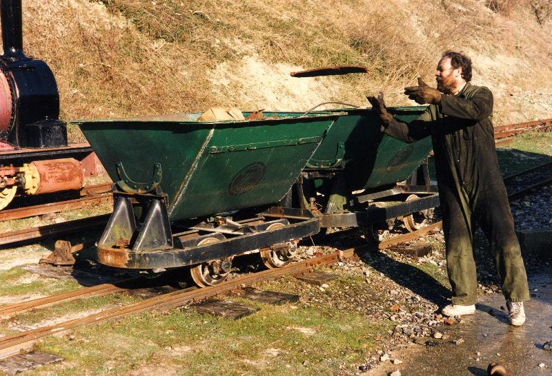 scrap-drive01.jpg - Every now and then the Museum has a scrap drive and unwanted lumps of metal are collected to sell as scrap. Peter Smith lobs an old fire bar into a skip.