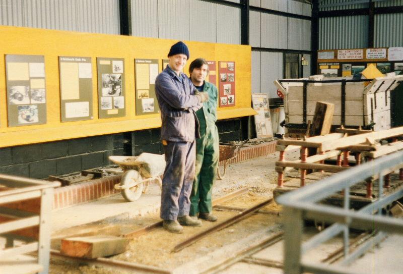 exhibitionists1.jpg - The original brown exhibition shed received one of its periodic revamps - Martin and Keith take a brake for a smoke before laying out a new display track.