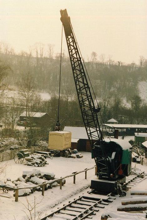 snow08.jpg - The woodyard looks idyllic in this shot. The Smith & Rodley steam crane stands sentinal. Not many people around.